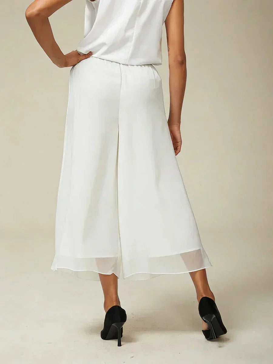 Pantaloni a gamba dritta con lunghezza cropped e sovrapposizione in chiffon