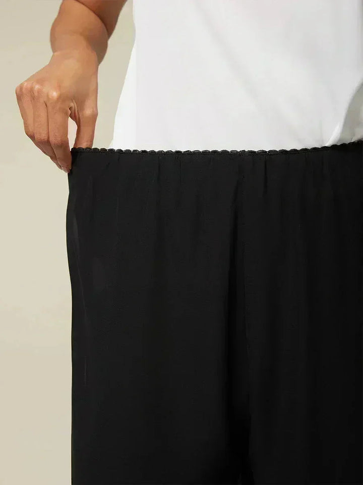 Pantaloni a gamba dritta cropped con sovrapposizione di chiffon